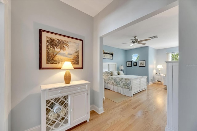 bedroom featuring ceiling fan and light hardwood / wood-style flooring