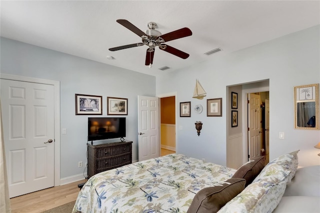 bedroom with light hardwood / wood-style floors and ceiling fan