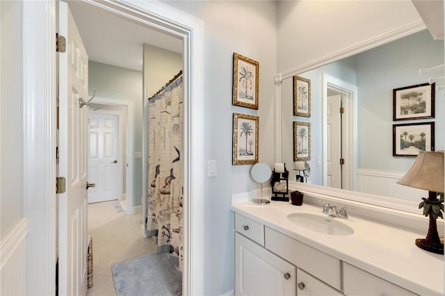 bathroom featuring tile patterned flooring and vanity