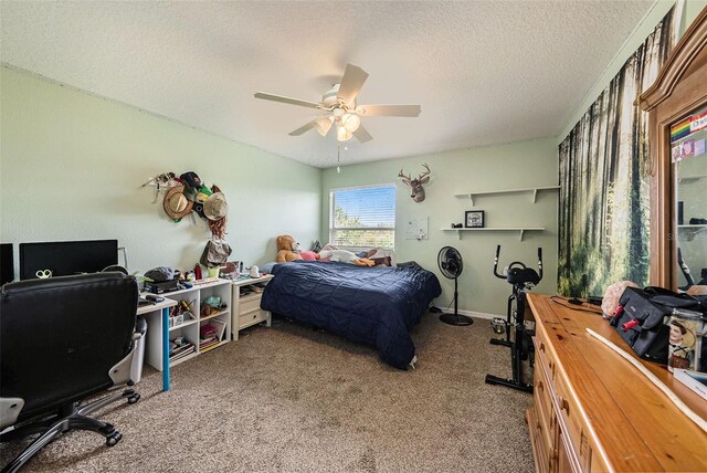 carpeted bedroom with ceiling fan and a textured ceiling