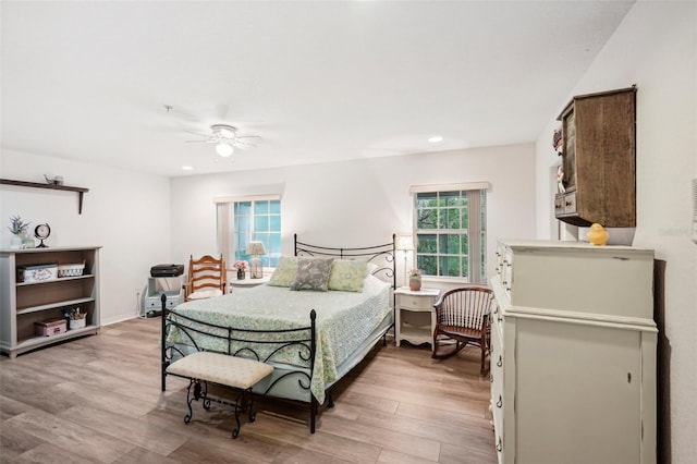 bedroom with ceiling fan and hardwood / wood-style floors