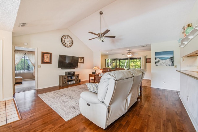 living room featuring ceiling fan, high vaulted ceiling, and dark hardwood / wood-style flooring