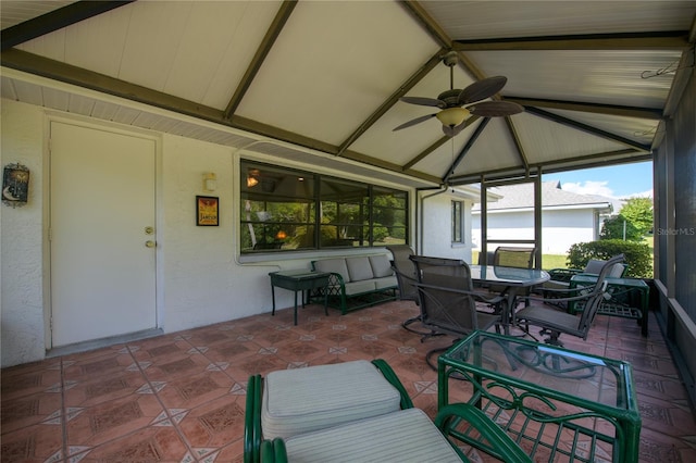 sunroom / solarium with vaulted ceiling with beams and ceiling fan