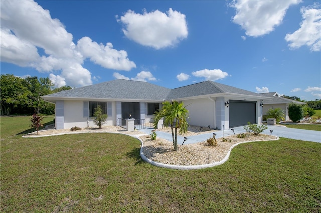 view of front facade with a front yard, a garage, and a porch