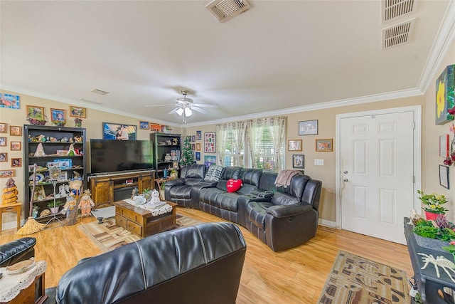 living room with ceiling fan, hardwood / wood-style flooring, and ornamental molding