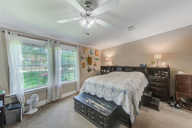 bedroom featuring ceiling fan, carpet flooring, and crown molding