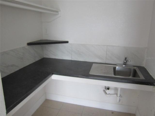 interior space featuring tile patterned flooring and sink