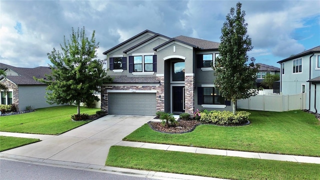 view of front of property featuring fence, an attached garage, stucco siding, stone siding, and a front lawn