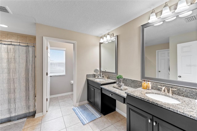 full bath featuring a sink, double vanity, and visible vents