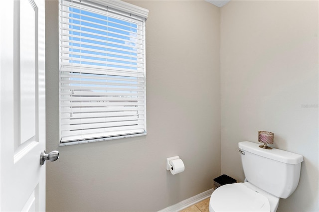 bathroom featuring toilet and tile patterned floors