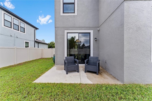 view of patio featuring fence