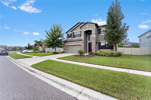 view of front facade featuring a garage and a front yard