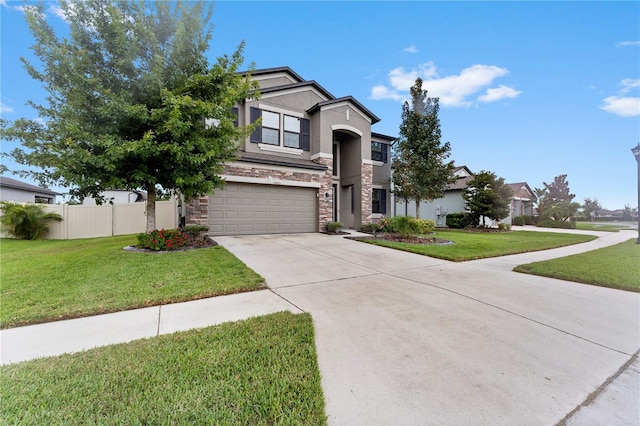 view of front of home with a front lawn and a garage