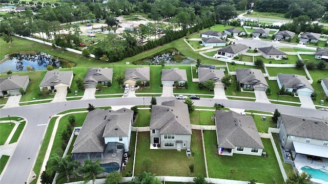bird's eye view with a water view and a residential view
