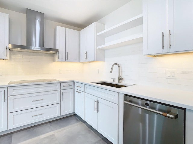 kitchen with white cabinetry, stovetop, wall chimney range hood, and stainless steel dishwasher