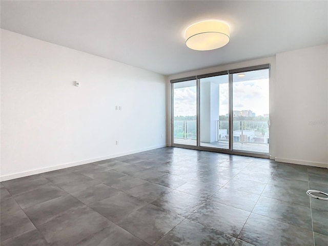 spare room featuring expansive windows