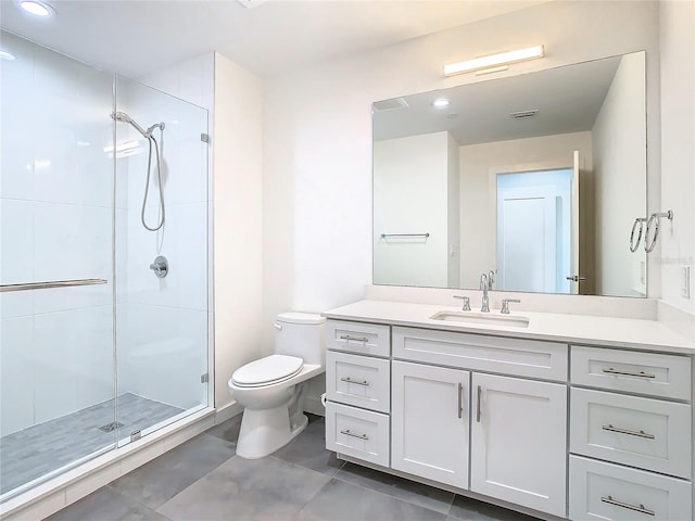 bathroom featuring toilet, tile patterned flooring, walk in shower, and vanity