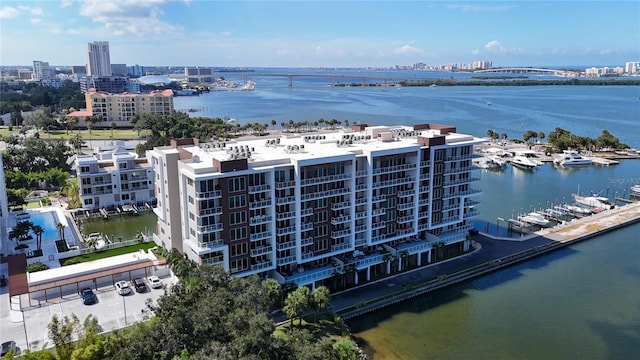 birds eye view of property with a water view