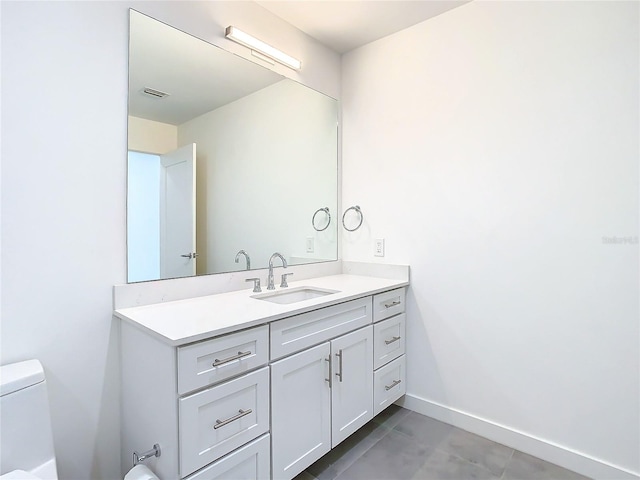 bathroom with tile patterned floors, toilet, and vanity