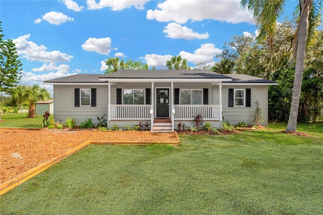 single story home with a porch and a front yard