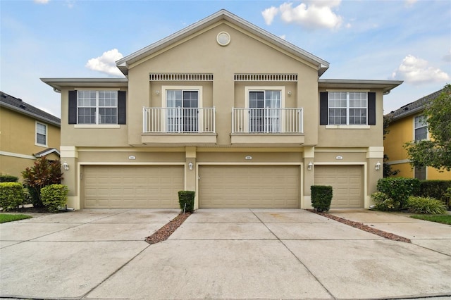 multi unit property featuring a garage