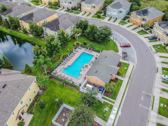 birds eye view of property with a water view