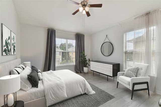 bedroom featuring light wood-type flooring and ceiling fan