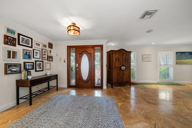 entrance foyer featuring ornamental molding