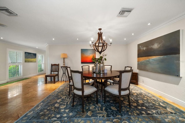 dining space with ornamental molding and a chandelier