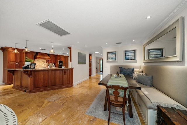 living room with crown molding and sink