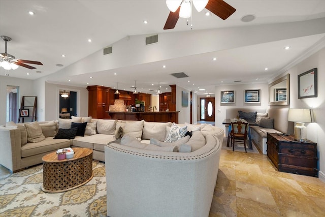 living room featuring ceiling fan, crown molding, and lofted ceiling