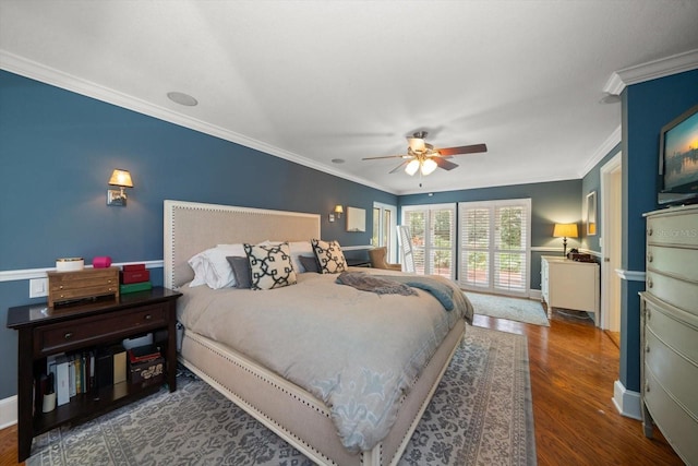 bedroom with ceiling fan, crown molding, and dark wood-type flooring