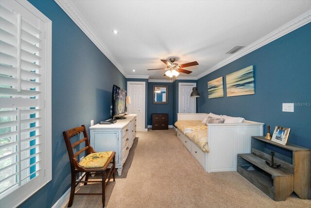 bedroom with light carpet, ceiling fan, and ornamental molding