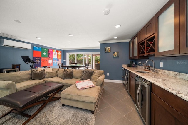 living room with washer / clothes dryer, an AC wall unit, wet bar, and ornamental molding