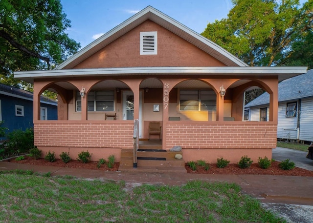 view of front of home featuring covered porch