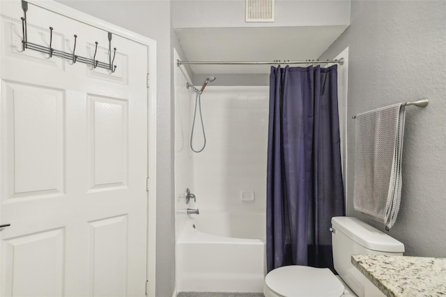 full bathroom featuring shower / bath combo with shower curtain, vanity, and toilet