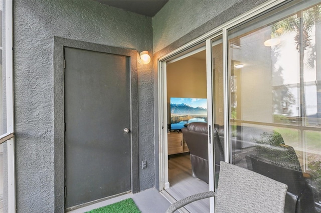 doorway to outside featuring hardwood / wood-style flooring