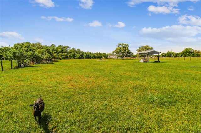 view of yard with a gazebo and a rural view