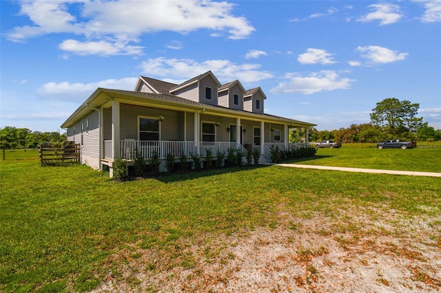 farmhouse featuring a front yard and covered porch