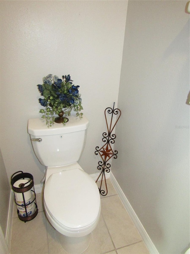 bathroom featuring toilet and tile patterned floors