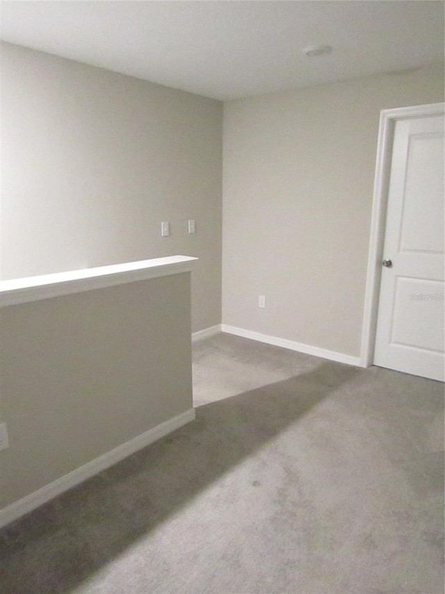 empty room featuring carpet flooring