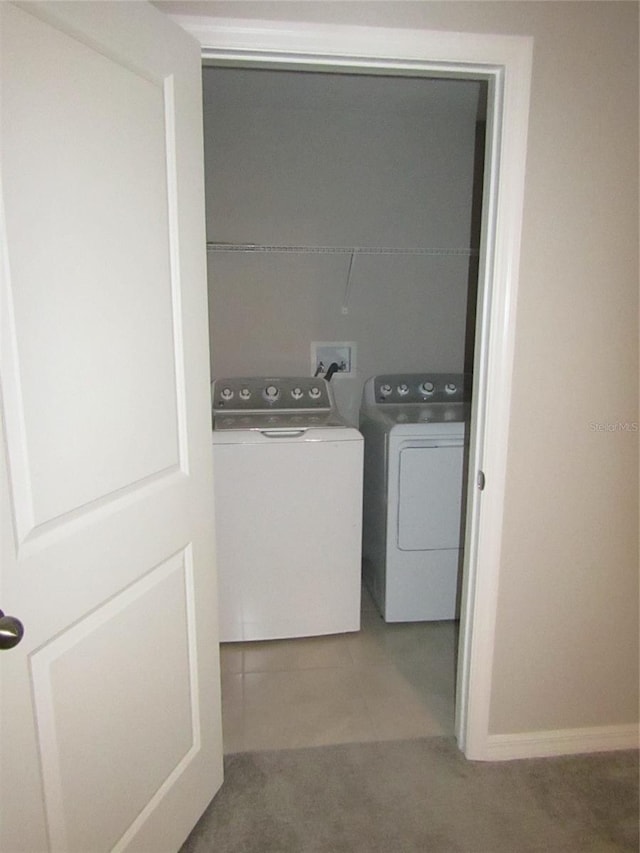 laundry room with carpet floors and independent washer and dryer