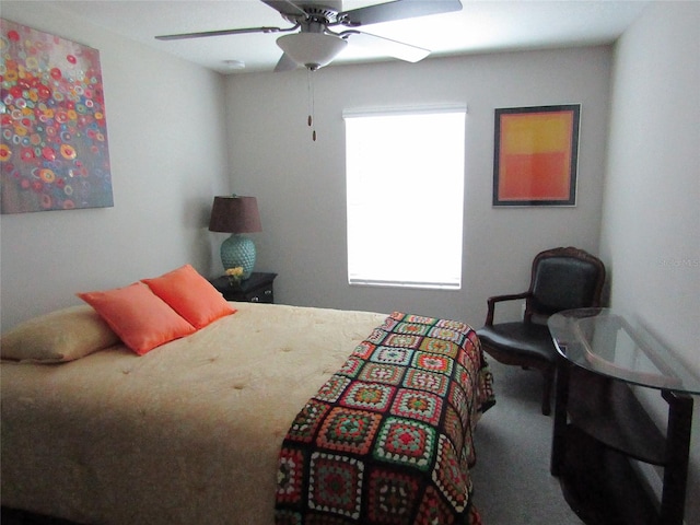 bedroom with ceiling fan and carpet floors