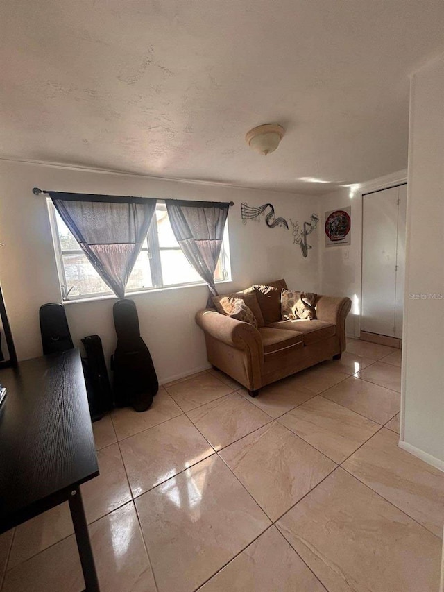 unfurnished living room with light tile patterned floors