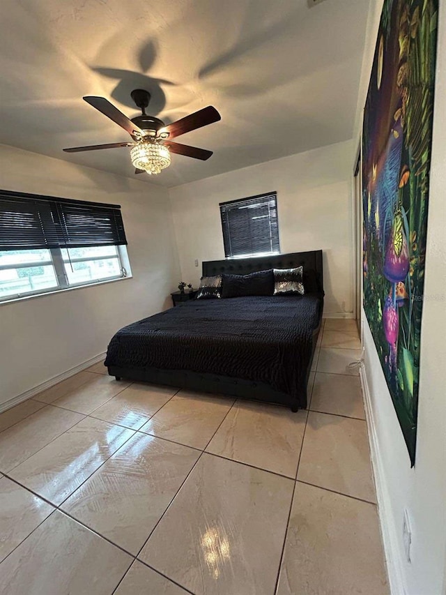 bedroom featuring ceiling fan and light tile patterned floors