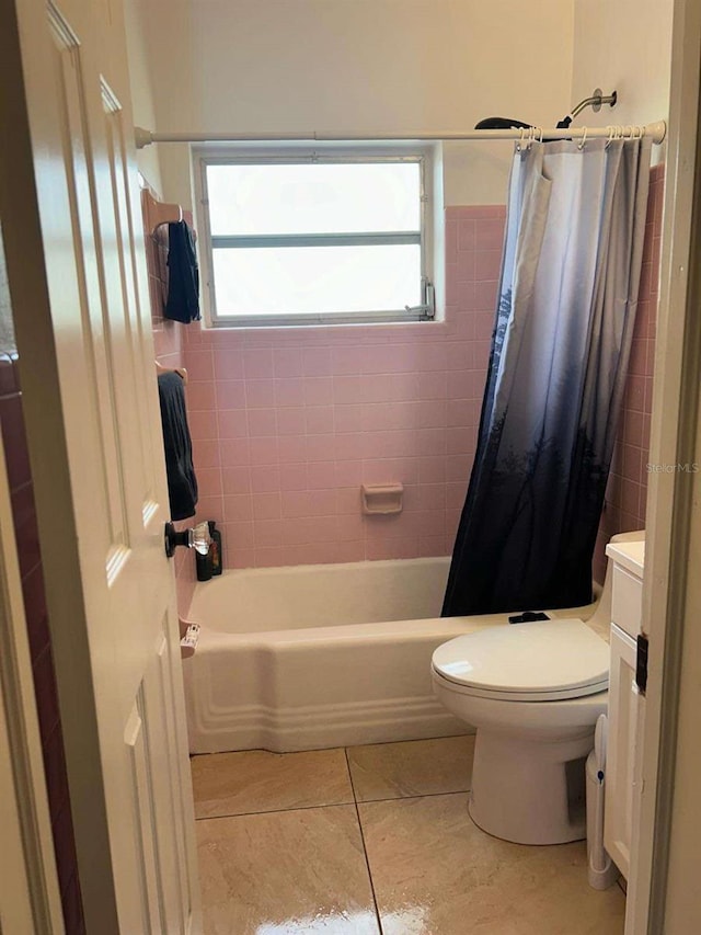 full bathroom featuring shower / tub combo, vanity, toilet, and tile patterned floors