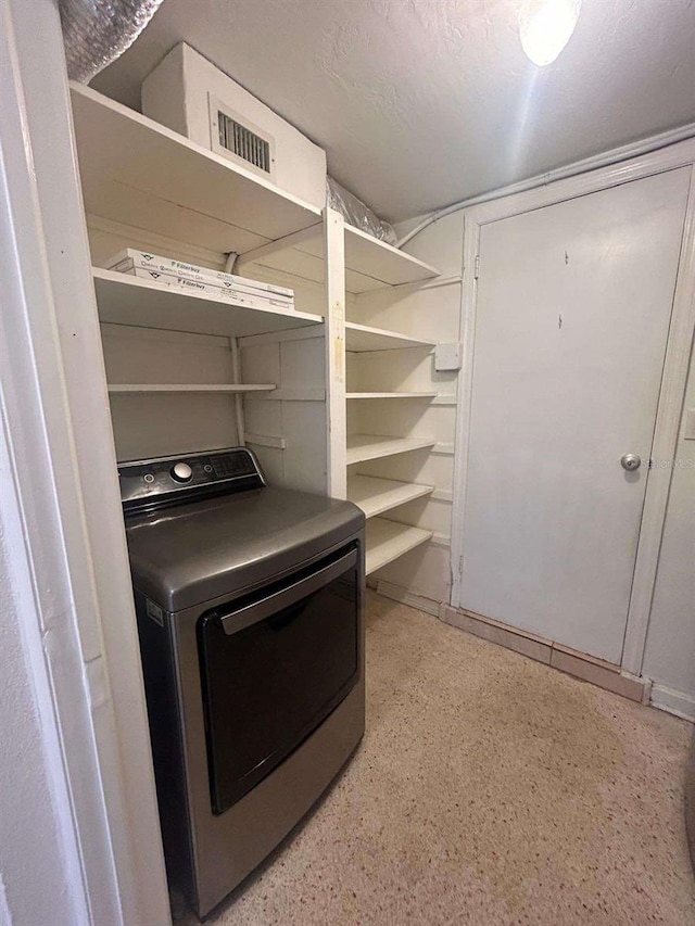 laundry room with washer / dryer