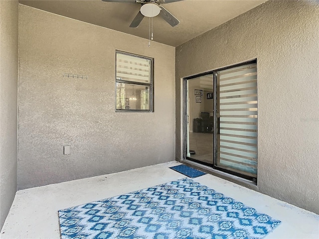 view of patio featuring a ceiling fan