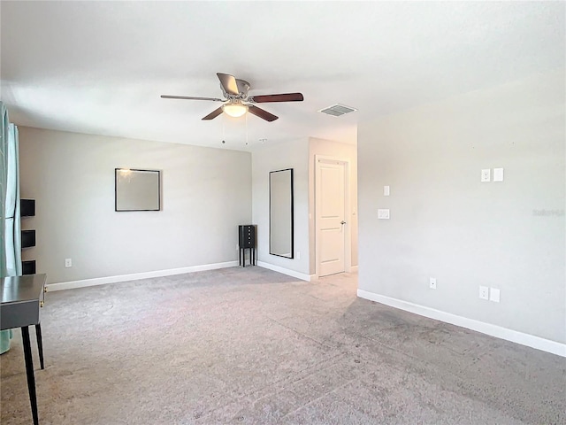 unfurnished room featuring visible vents, ceiling fan, and baseboards