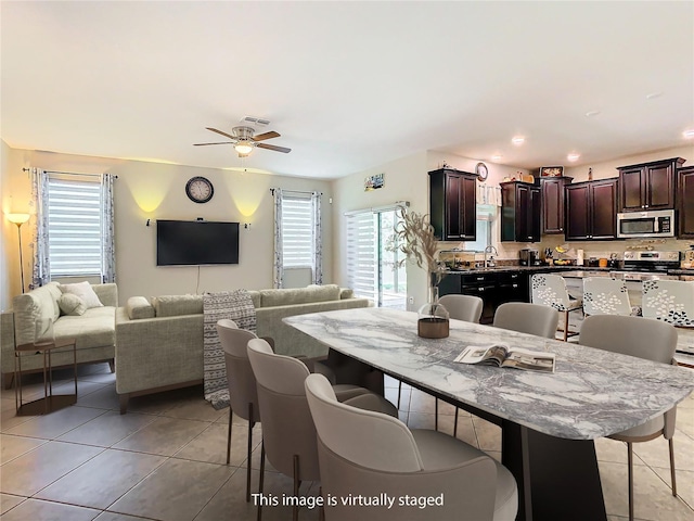 dining area featuring light tile patterned floors, a ceiling fan, and recessed lighting